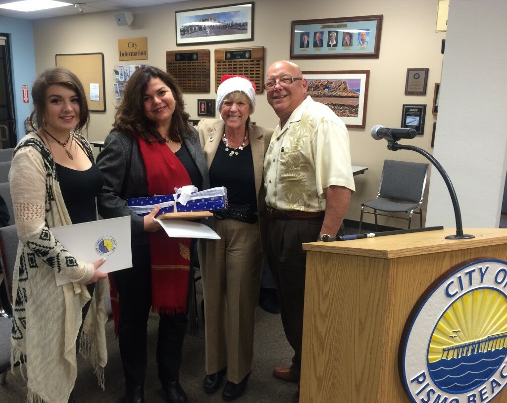 The Spinelli family received a proclamation for the City of Pismo Beach for their annual contributions to the city’s Holiday Harmony event. Pictured are Antonia, Marcia and Tony Spinilli with Mayor Shelly Higginbotham. Photo by Mary Ann Reiss